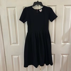 Black LuLaRoe dress with pockets and back zipper. Great condition size small